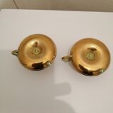 A PAIR OF SMALL COPPER CANDLE HOLDERS