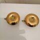 A PAIR OF SMALL COPPER CANDLE HOLDERS