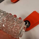 Bathroom lamps in a nice orange colour with a crystal glass shade and a base of hard thin plastic