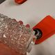 Bathroom lamps in a nice orange colour with a crystal glass shade and a base of hard thin plastic