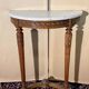 Console demie lune de style Louis XVI en bois sculpté