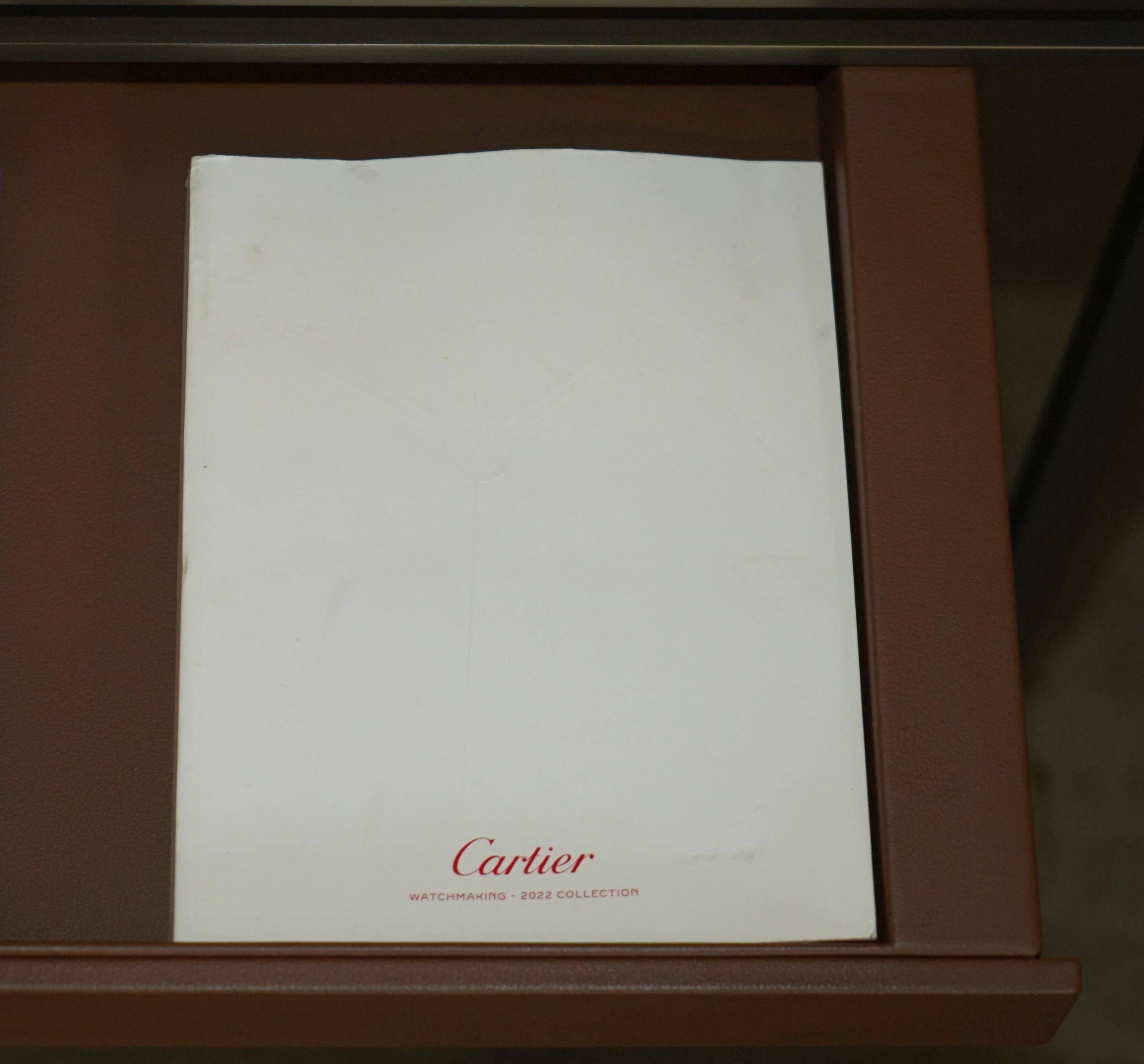 Modern mid-century writing desk signed Cartier in bronze and leather.