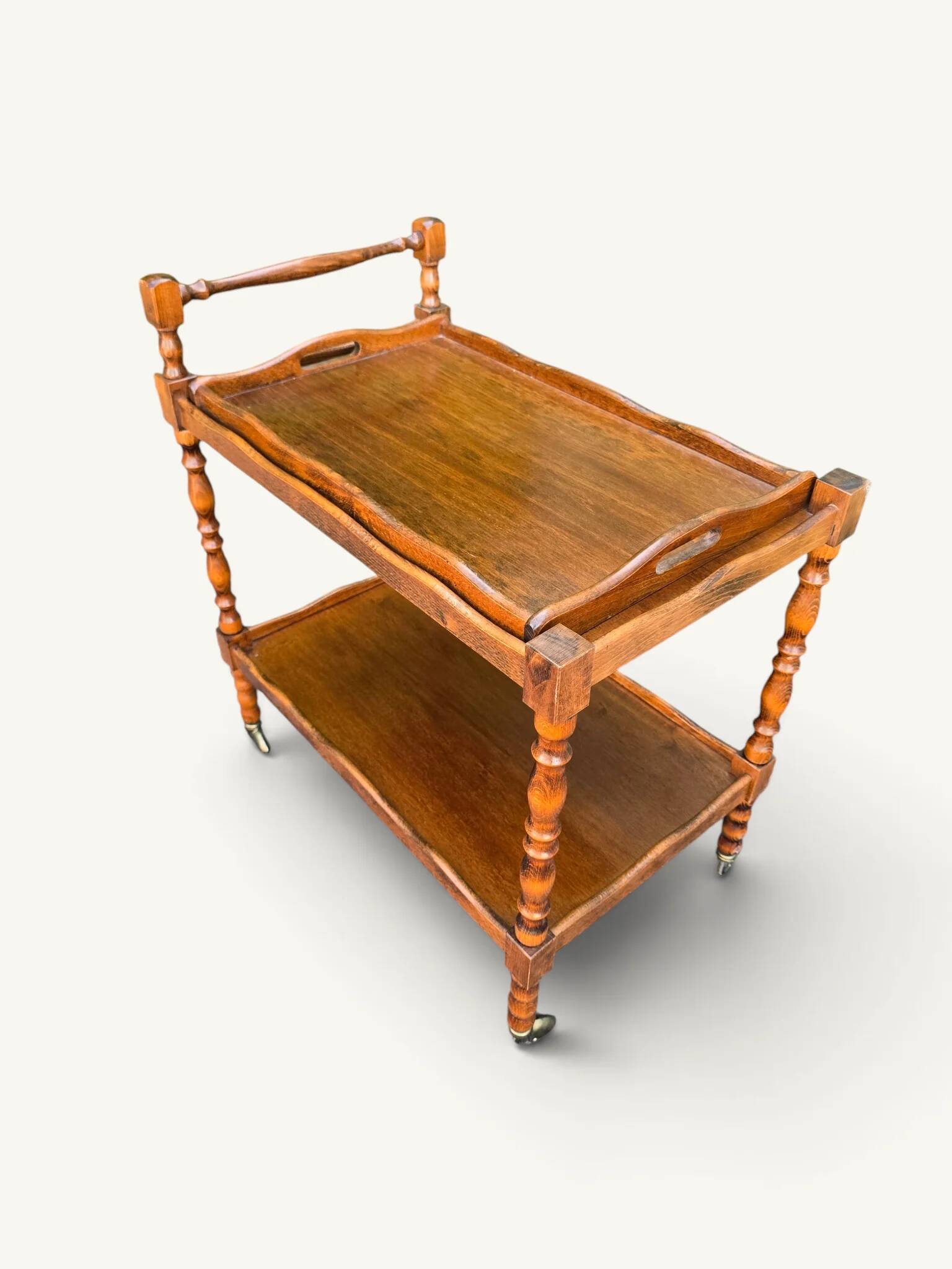 Vintage wooden turned rolling dessert trolley, removable tray.