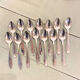 Series of 14 Art Deco dessert spoons, silver metal