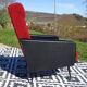 Vintage armchairs in red and black faux leather, the pair.
