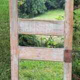Mirror (3 panels) on door.