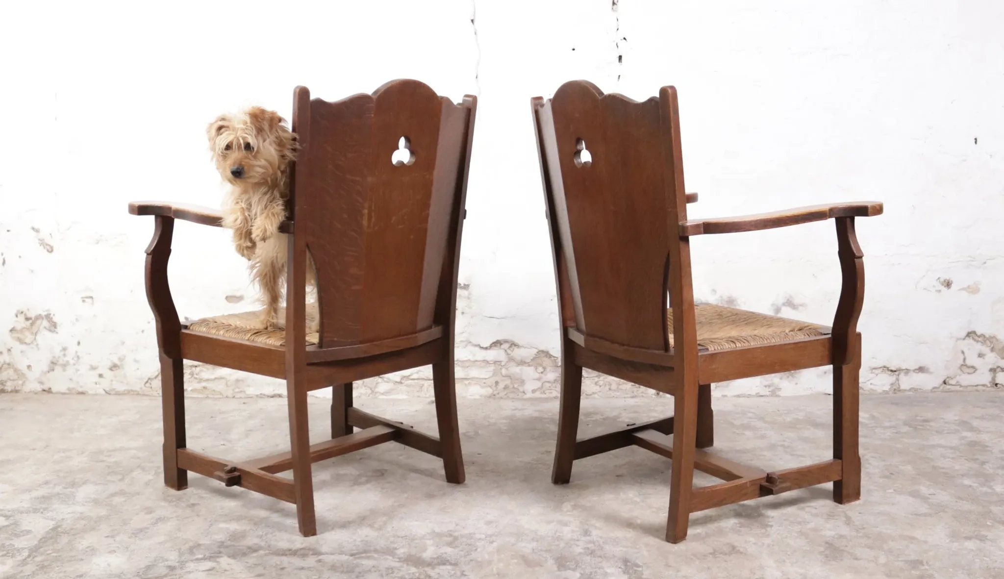 Pair of brutalist oak lounge chairs with rush seats – Netherlands