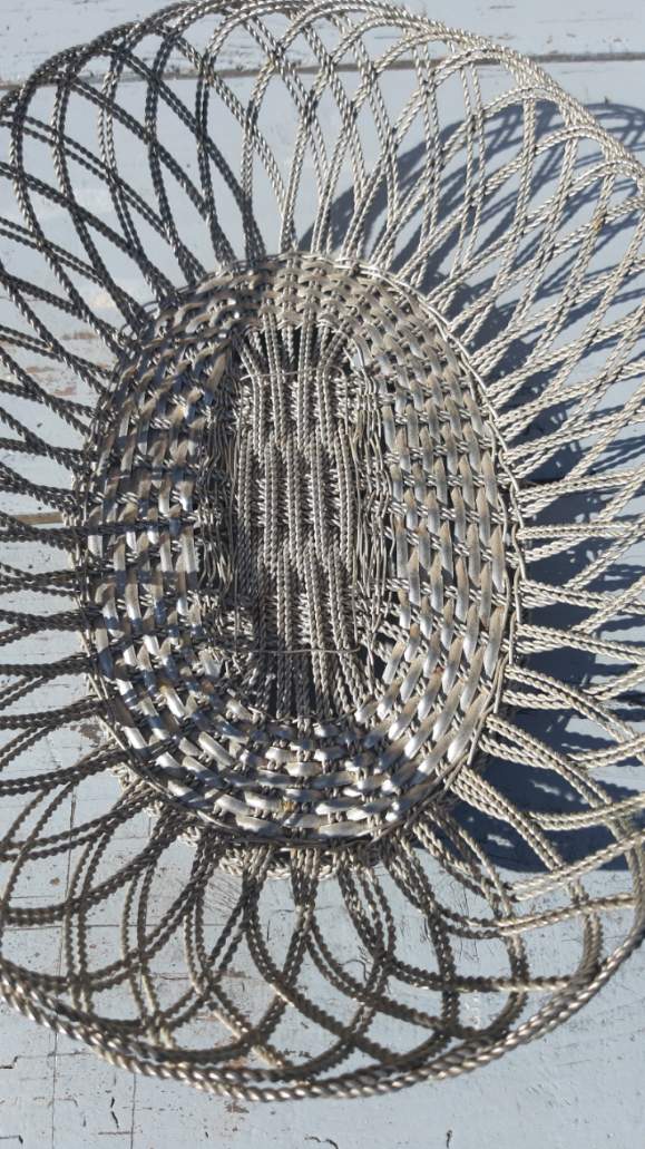 flat basket cut center table in woven metal