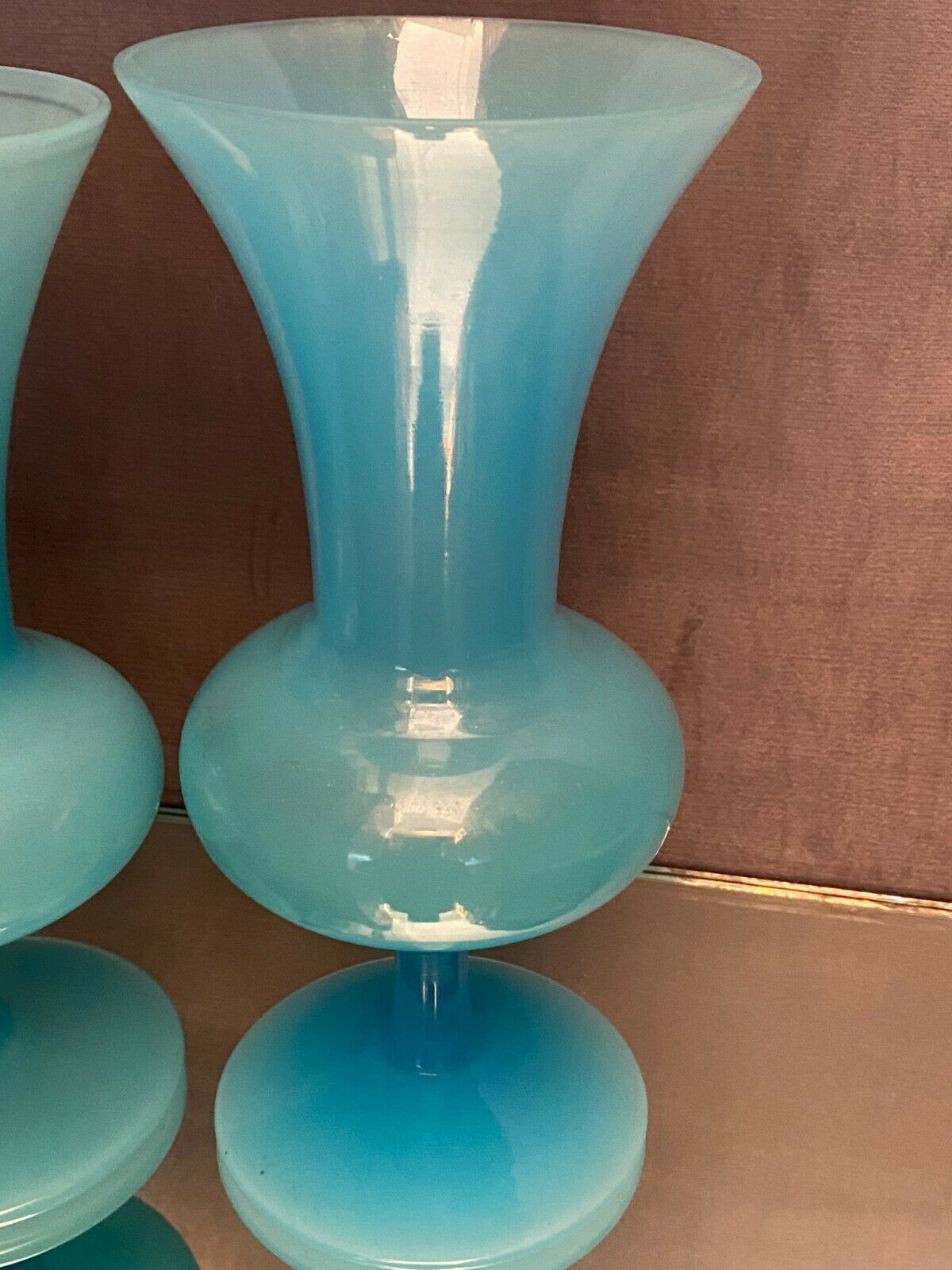 Two vases on a pedestal in blue opaline