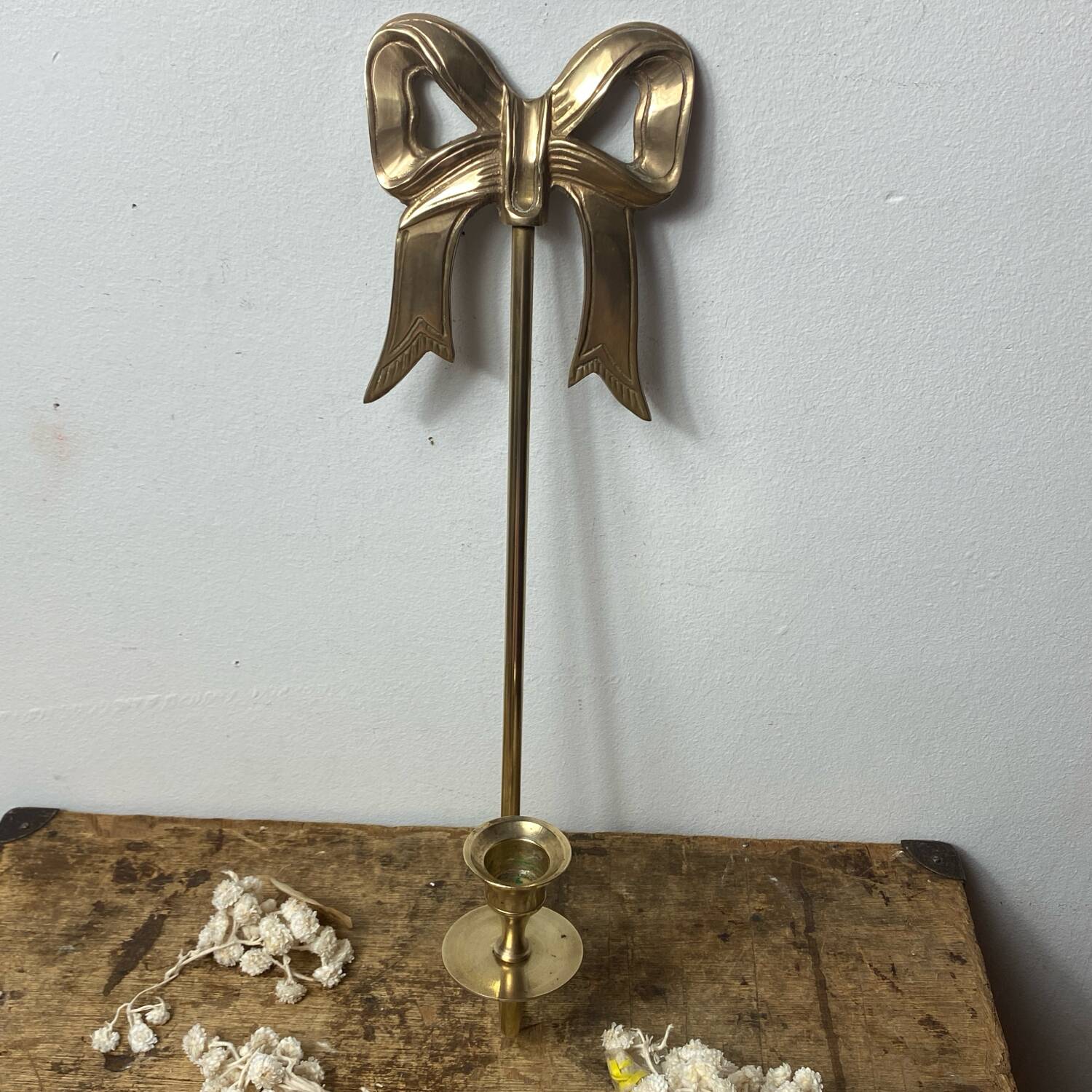Solid brass bow and ribbon wall candle holder