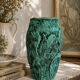 Vintage green patinated ceramic vase with raised floral decoration.