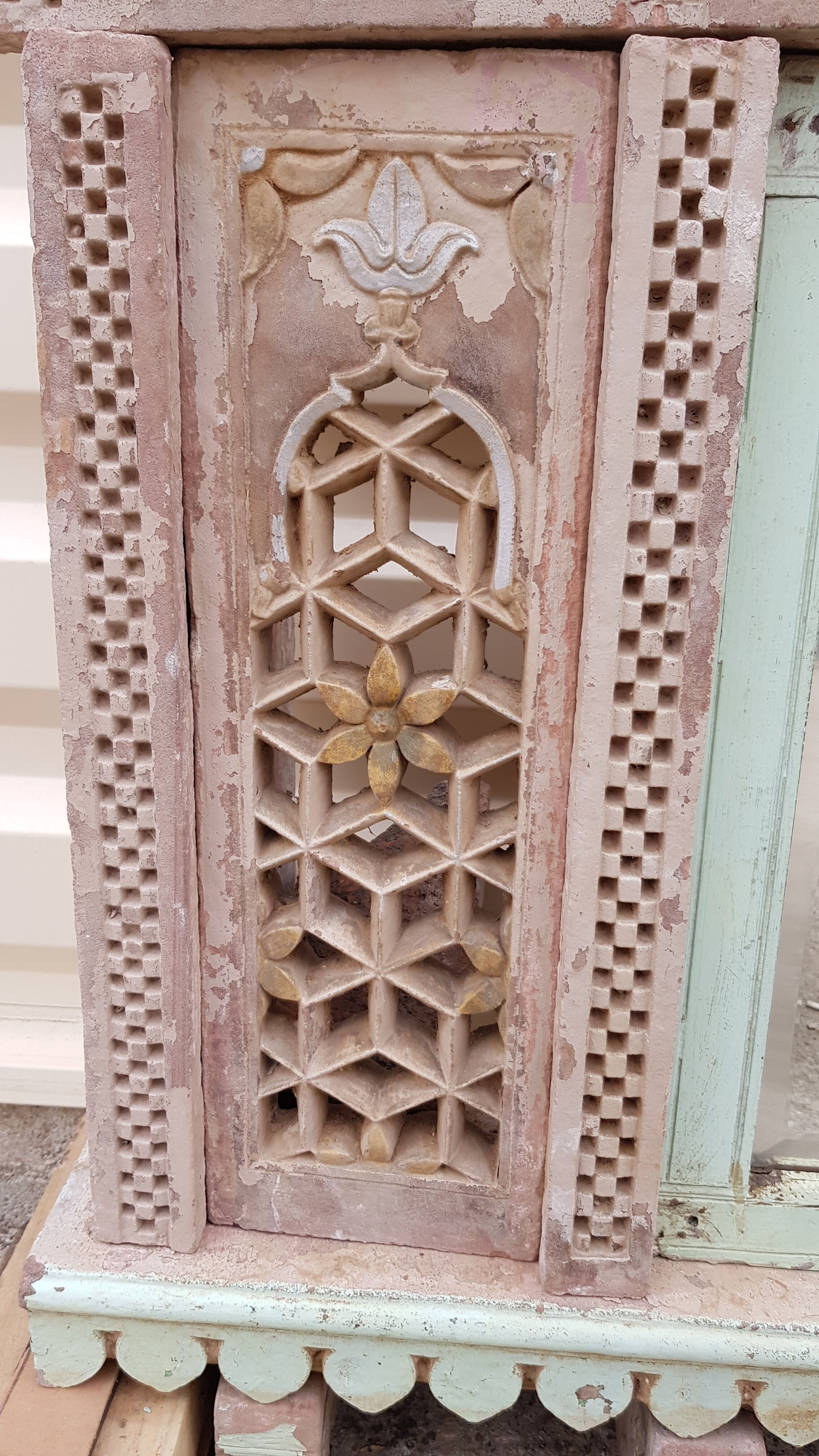 Fully hand-carved stone window with mirror