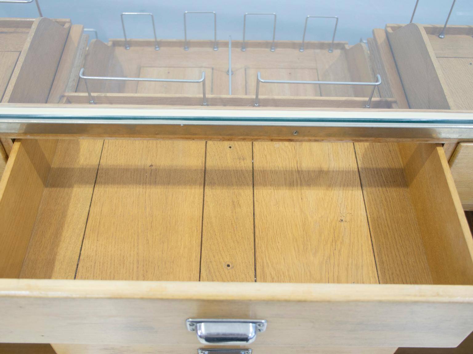 Shop counter made of birch and oak with twenty drawers, 1940s.
