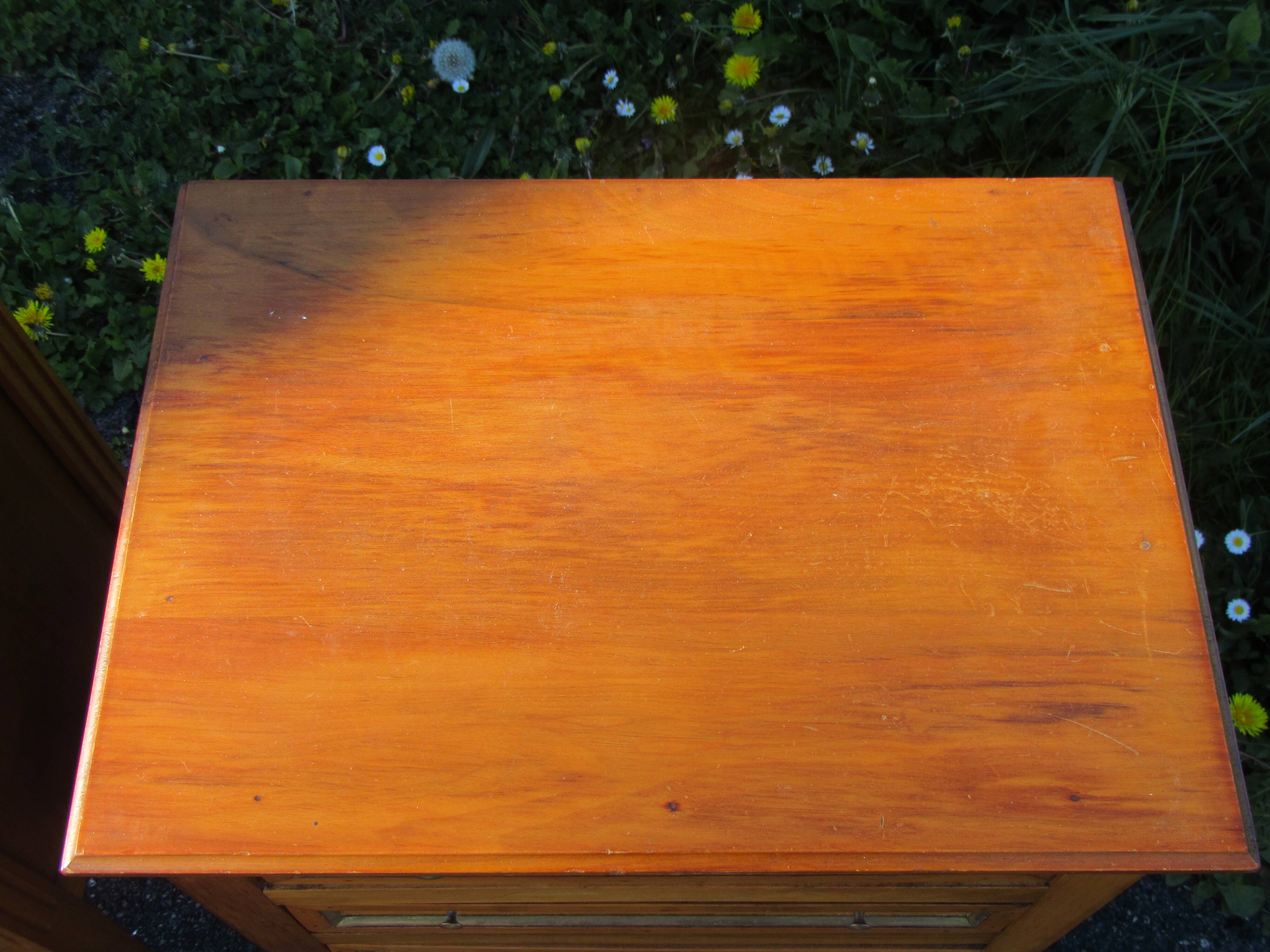 Pair of walnut bedside tables in Louis XVI style with brass inlay.