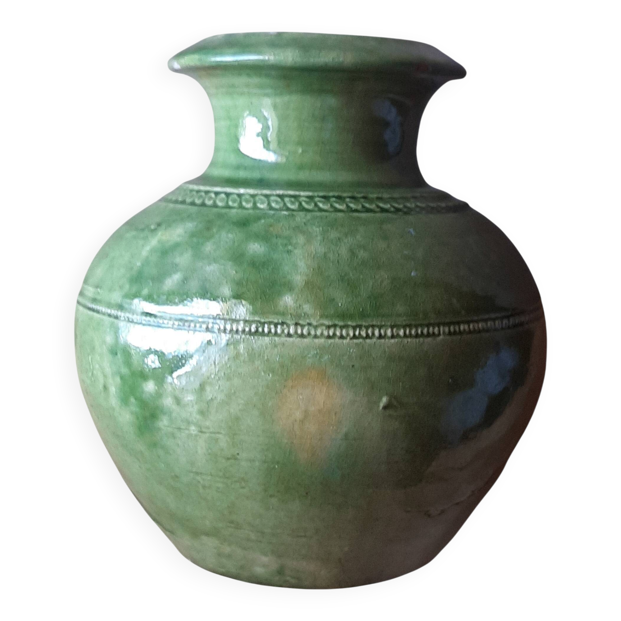 Ancient vase in glazed terracotta with green glaze.