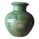 Ancient vase in glazed terracotta with green glaze.