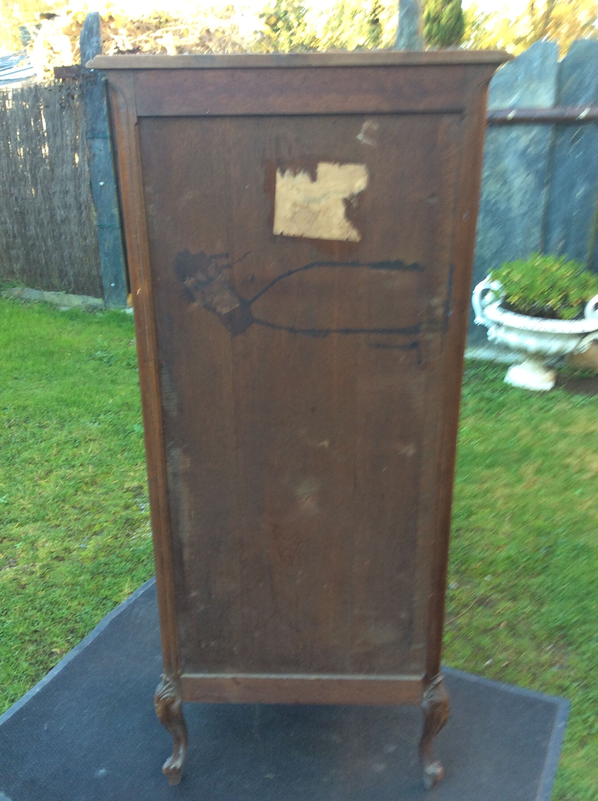 Louis XV Rocaille style showcase in solid walnut, beveled door glass.
