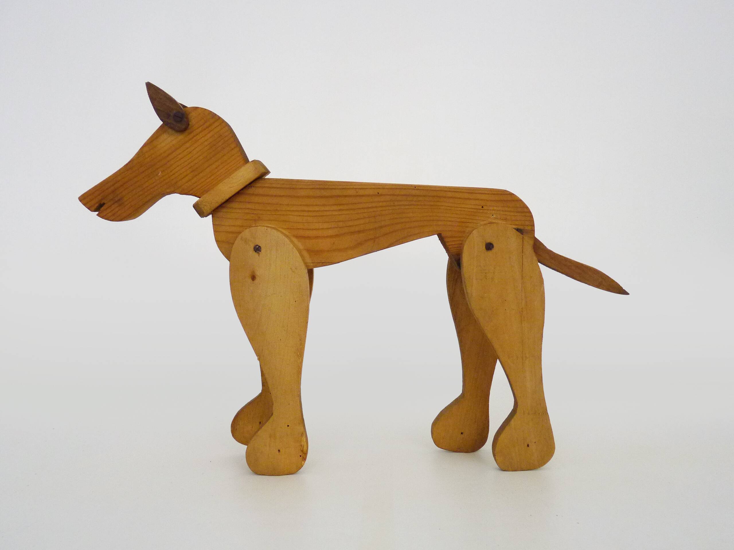 Articulated wooden dog toy. 1940s
