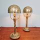 Pair of bronze and brass table lamps, early 20th century