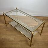 Rare bronze, brass, and steel mesh coffee table with a double glass top resting on a brass mesh. French work by Jansen