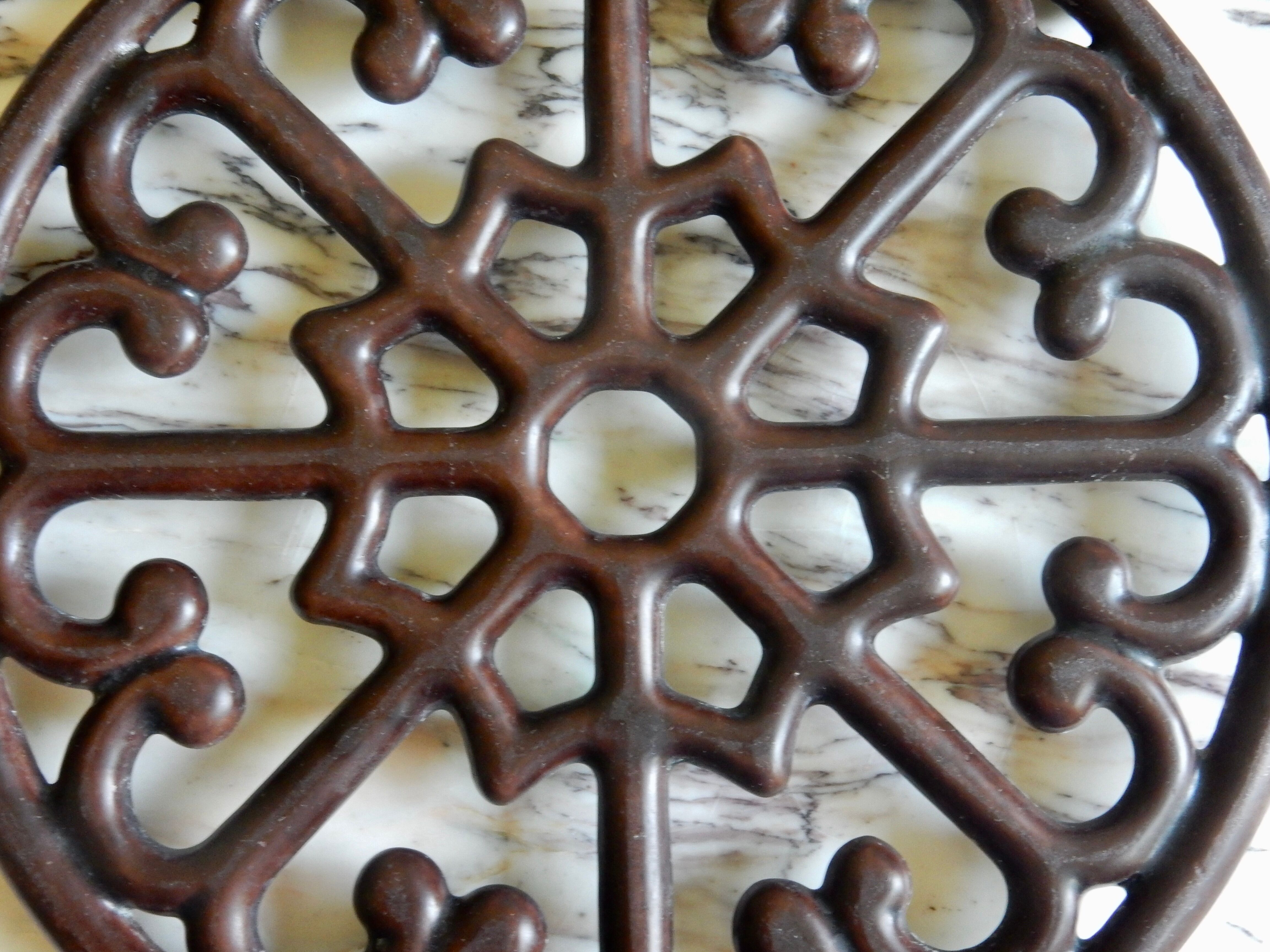 Brown enamelled cast iron trivet