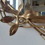 Round mirror in gilded wrought iron and leaves