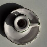 Small vintage hand-held candlestick in earthenware with green trim and floral decoration H10.5