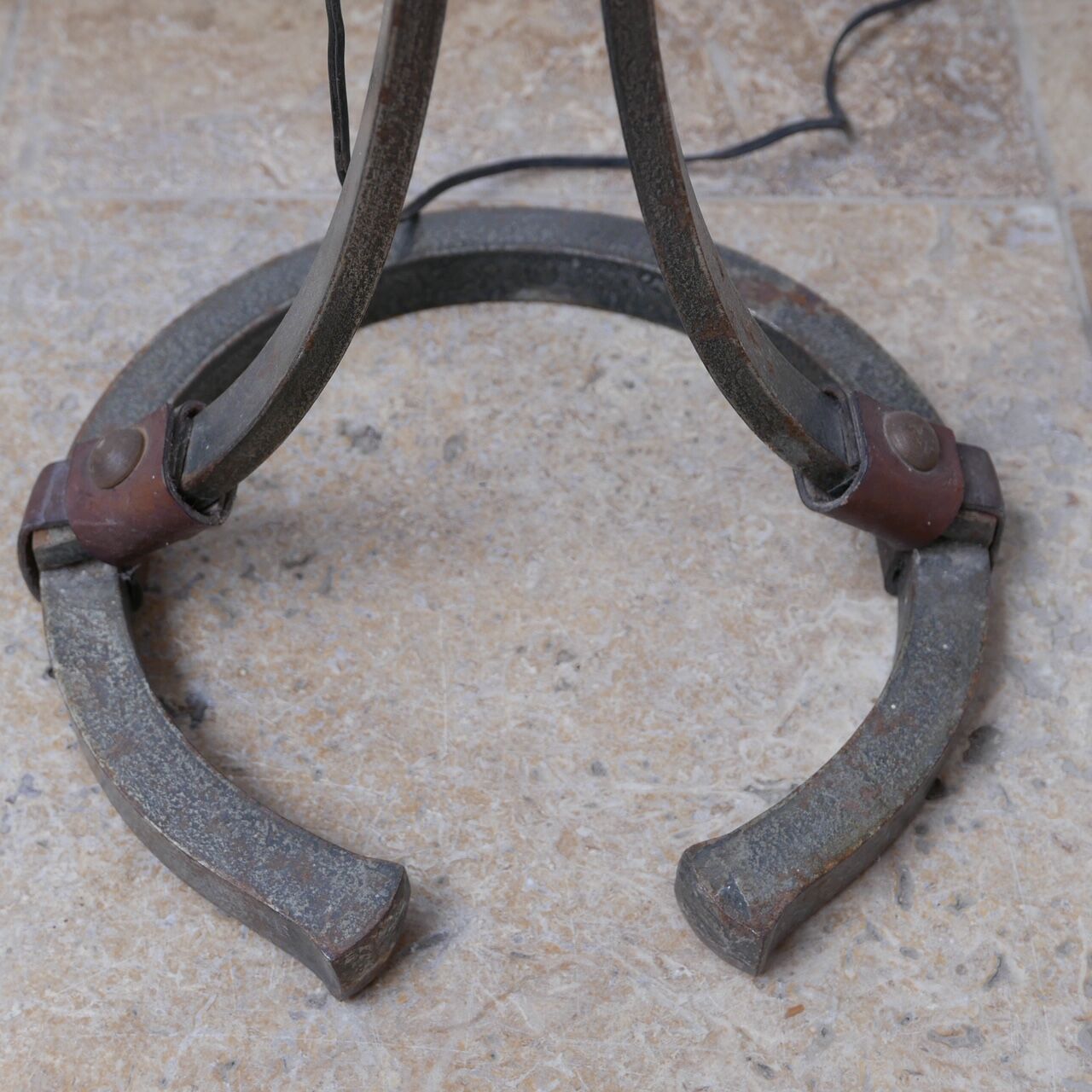 Leather and iron floor lamp by Jean-Pierre Ryckaert