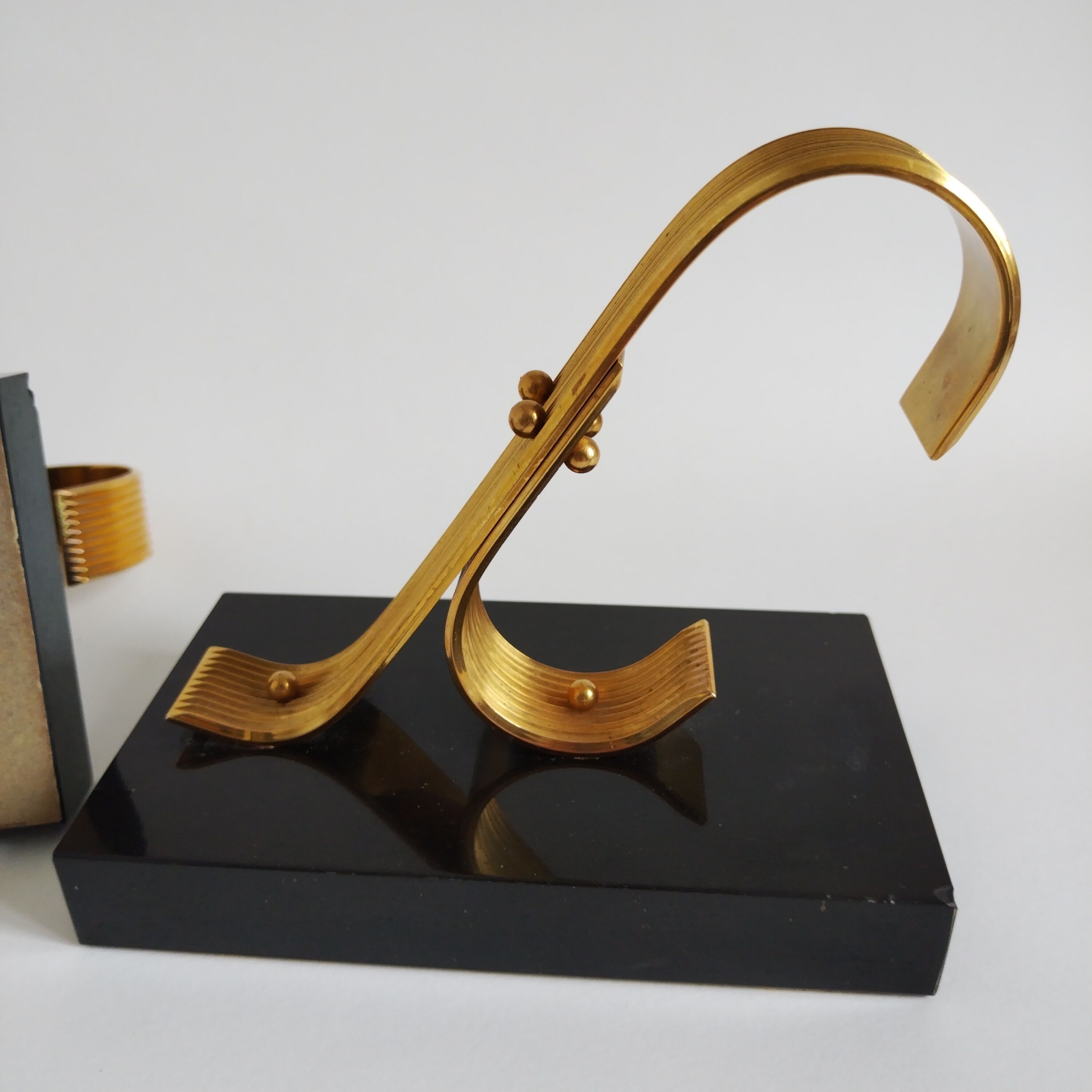 Pair of vintage Art Deco style bookends in marble and gold-plated metal