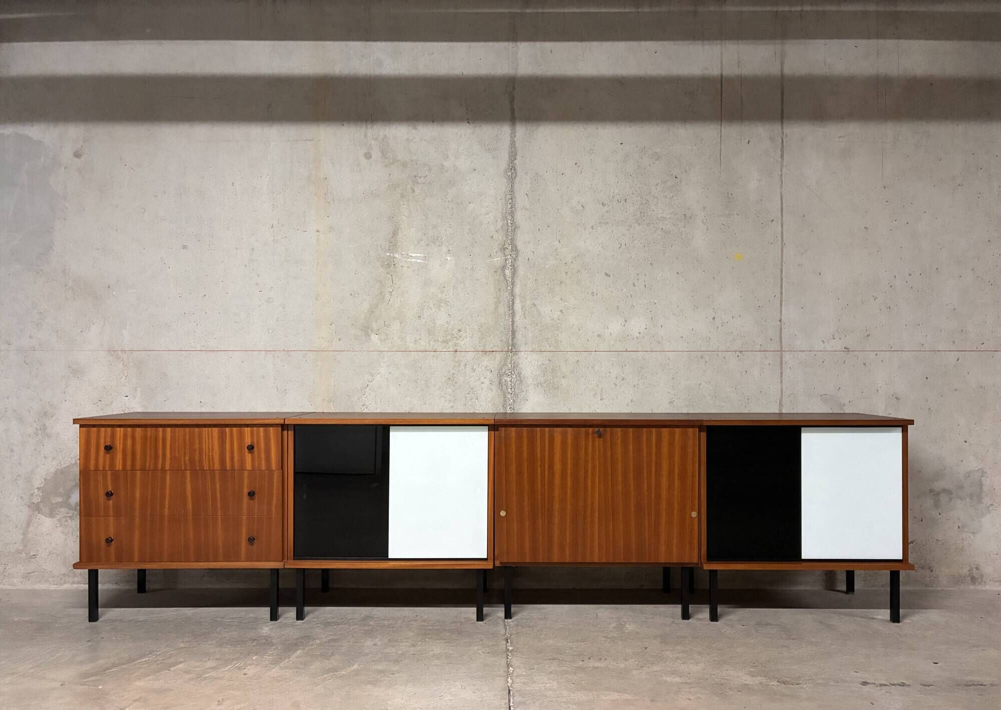 Enfilade buffet display cabinet in vintage 1950s style.