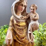 Statue of the Virgin holding the Child Jesus in polychrome terracotta.