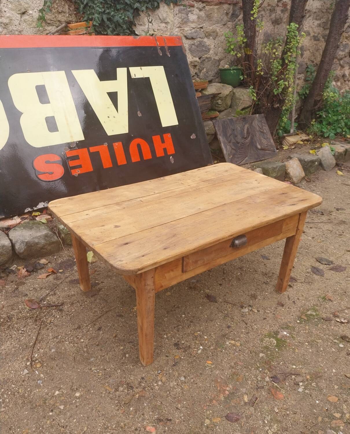Wooden coffee table with a drawer