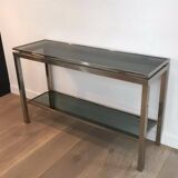 Beautiful console table in brushed metal with bluish glass shelves