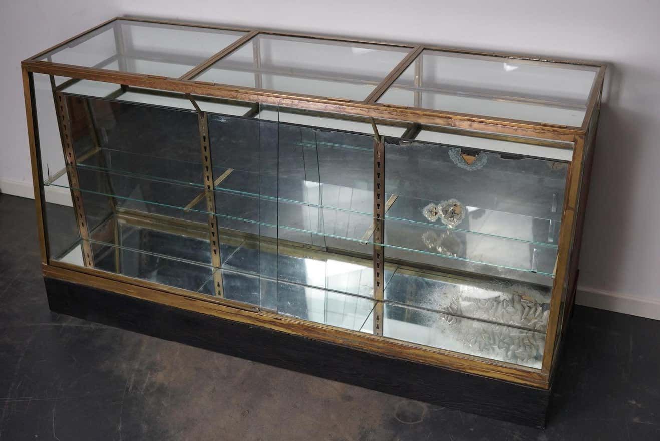 Counter or shop window in oak glass and brass France around 1920