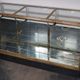 Counter or shop window in oak glass and brass France around 1920
