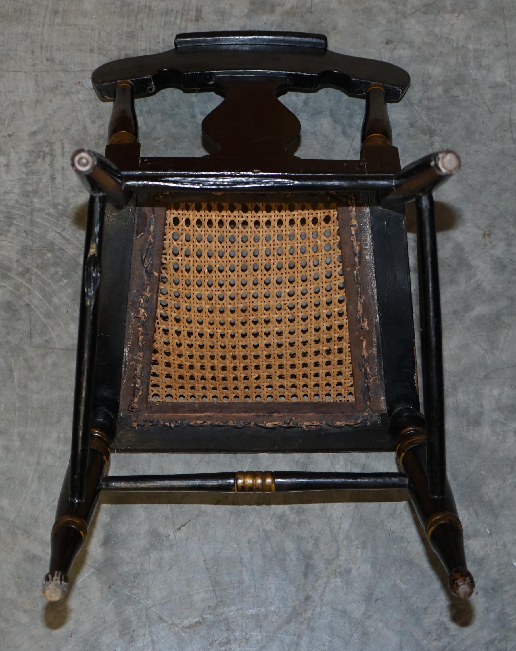Georgian side bergère circa 1825, ebonised and hand-painted in Baltimore style.