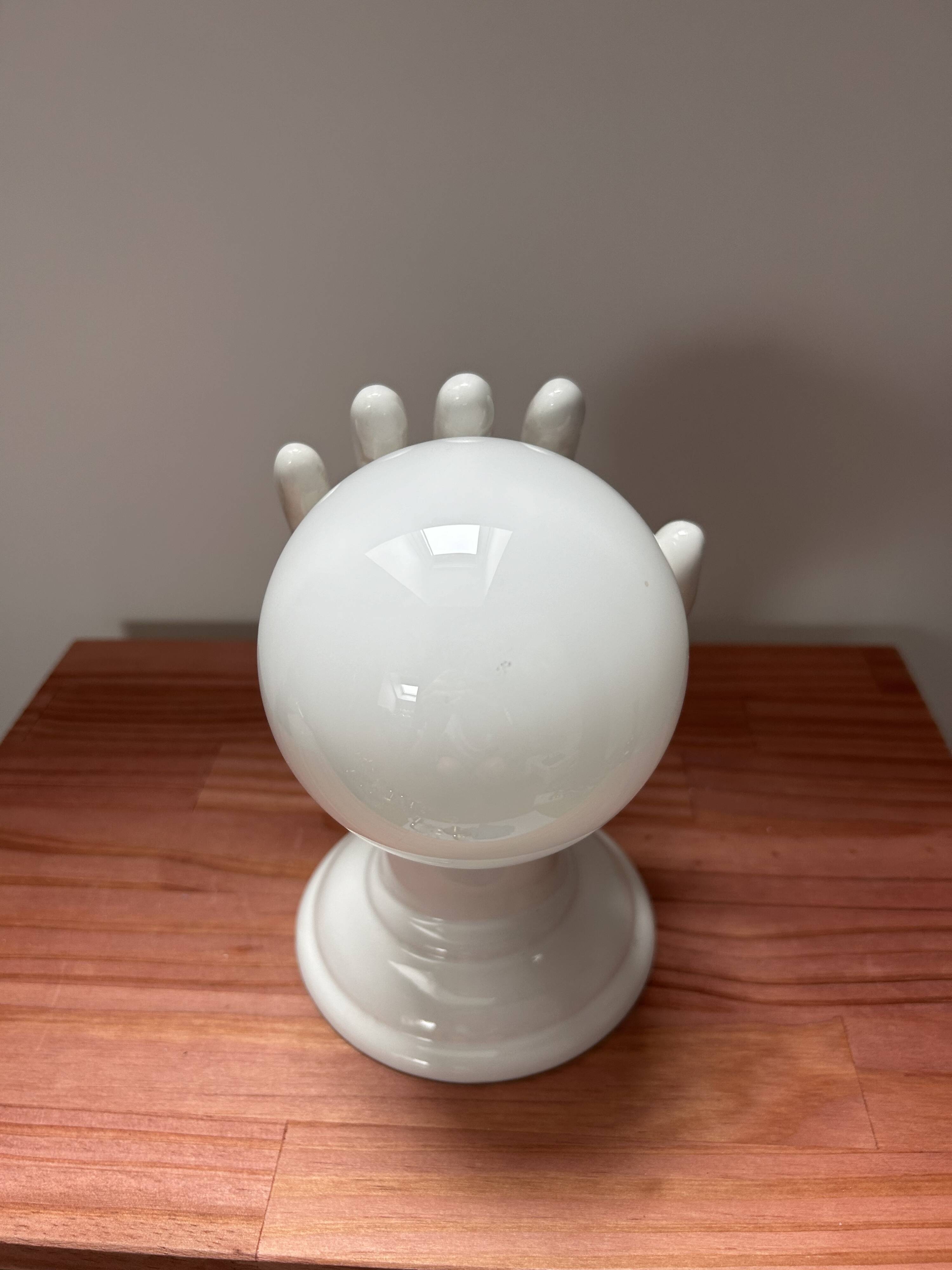 Ceramic hand wall light