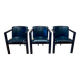 Set of 3 designer leather and metal armchairs.
