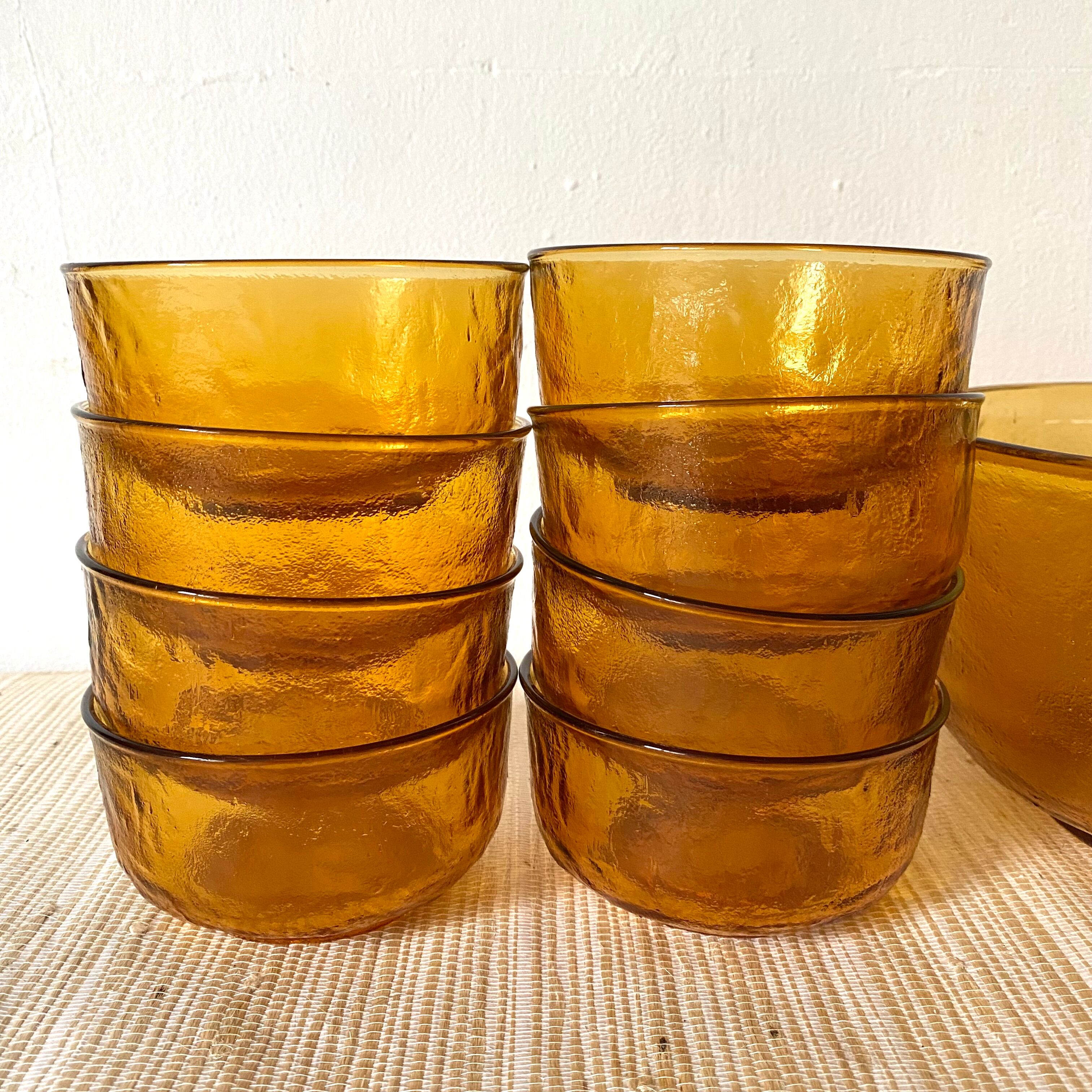 Salad bowl and bowls in amber glass, 70s
