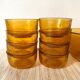 Salad bowl and bowls in amber glass, 70s