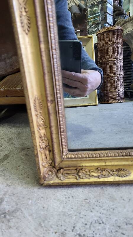 GOLDEN WOODEN MIRROR WITH PALMETTES FROM THE 19TH CENTURY