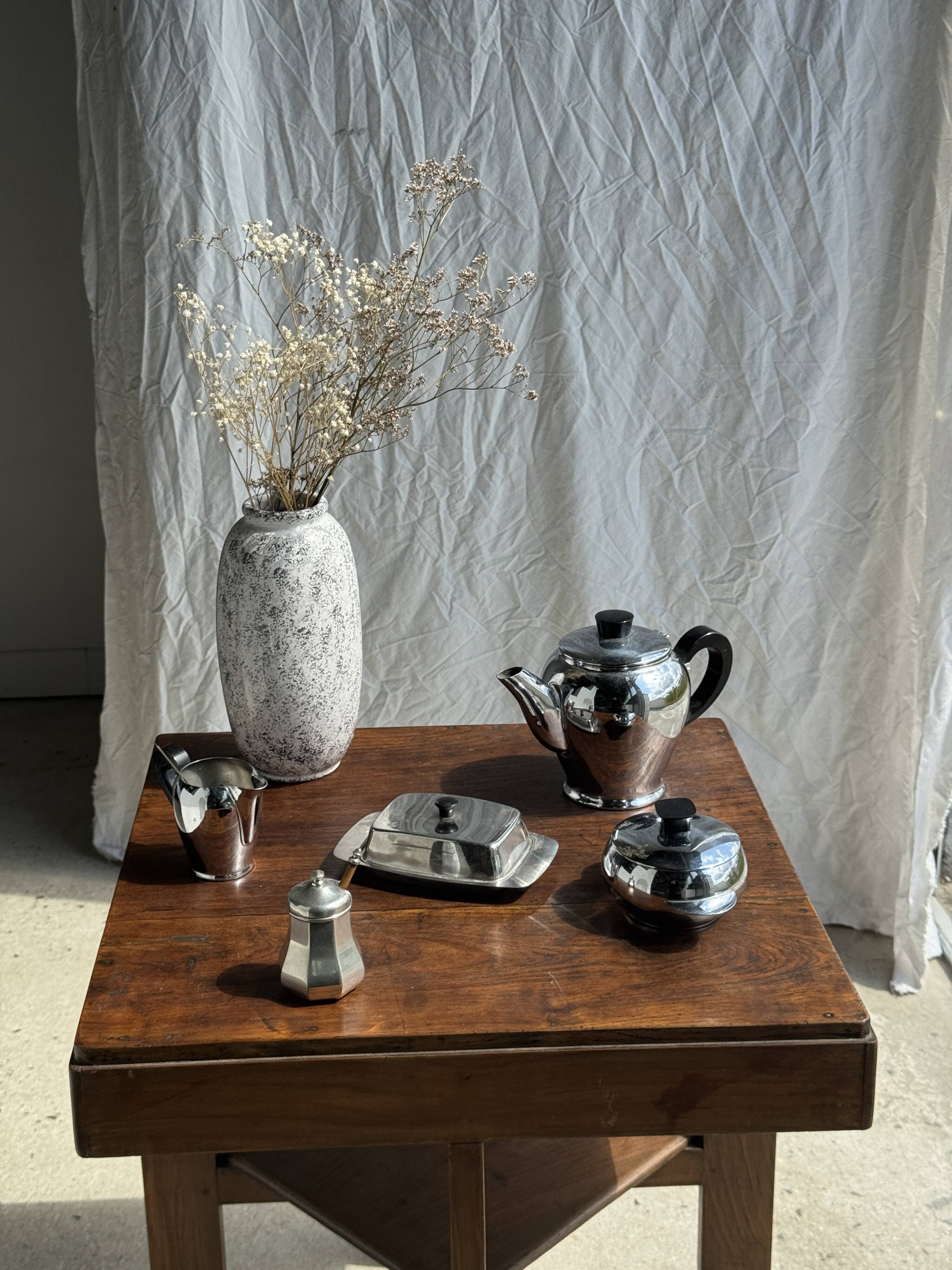 Tea set including teapot, milk jug, sugar bowl and butter dish