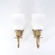 Three brass and opaque glass wall lights, 1950s.