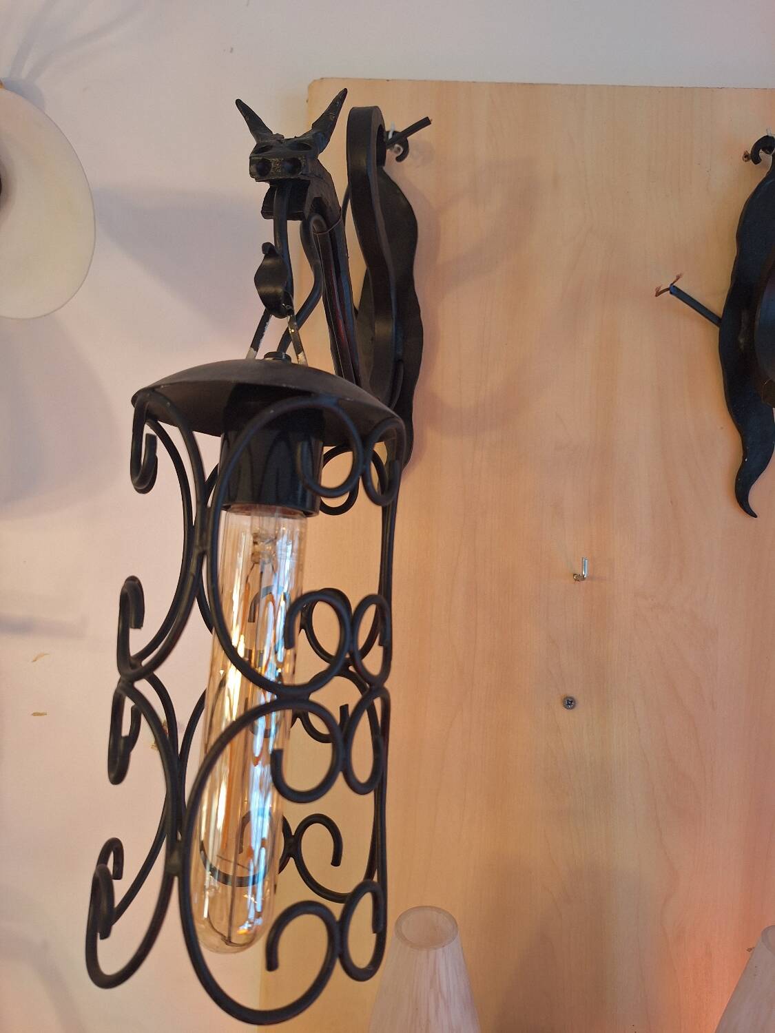 pair of wrought iron animal wall lights