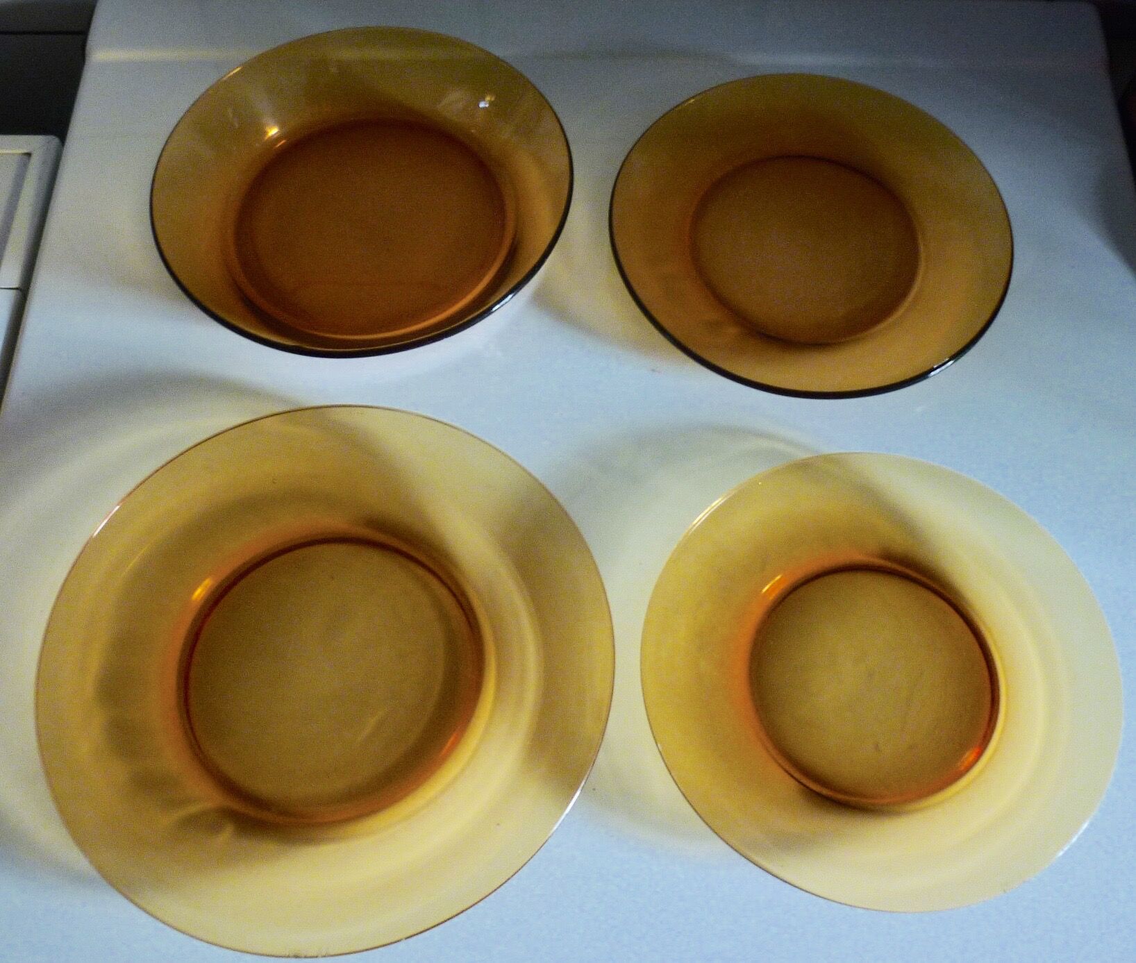 Lot of 4 mismatched plates amber glass