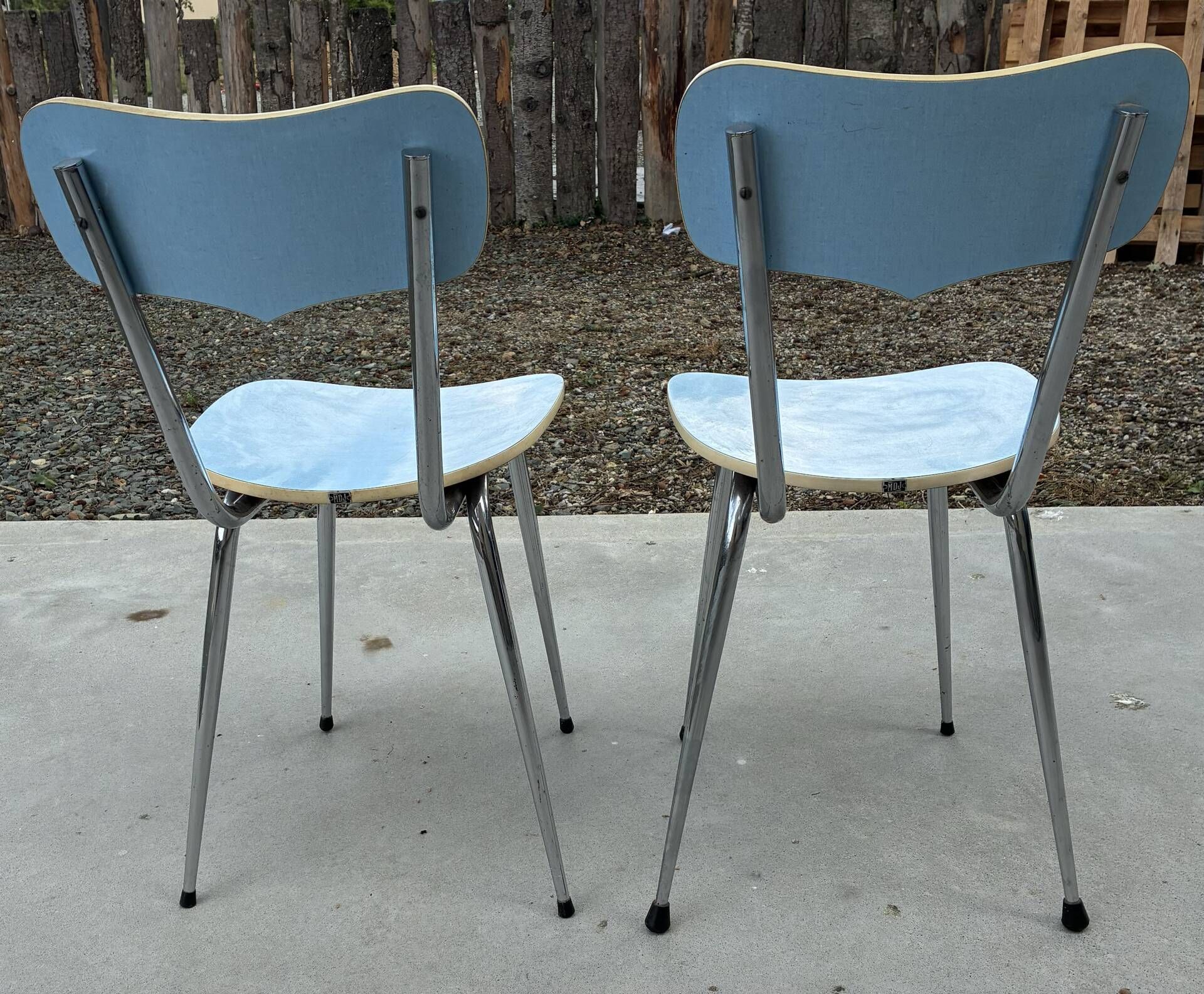 Two blue Formica "Peugeot" chairs.