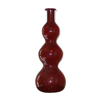 Decorative rounded bottle in red glass, Murano