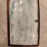 Isaac Lane Muse, brass and enamel plaque.