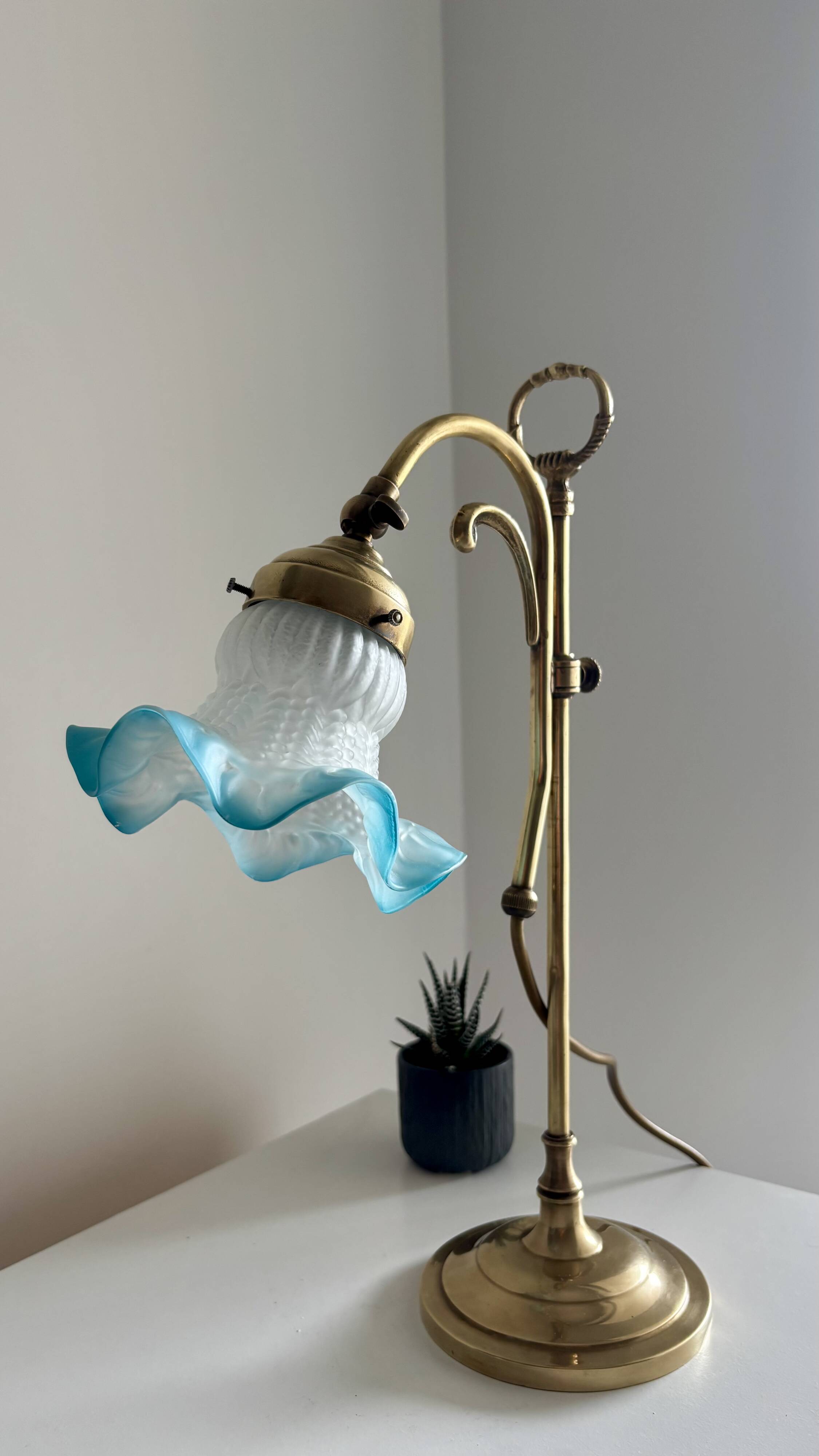 Art Nouveau style gilded brass lamp with sky blue opaline tulip