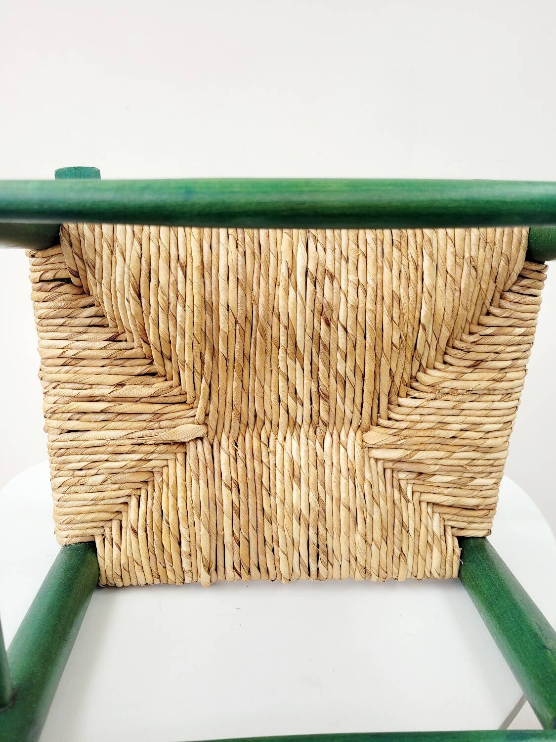 Small vintage children's chair in wood and green straw